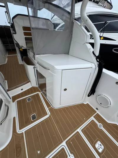  Yacht Photos Pics 2019 Pursuit DC 365 Dual Console interior with teak flooring and seating area.