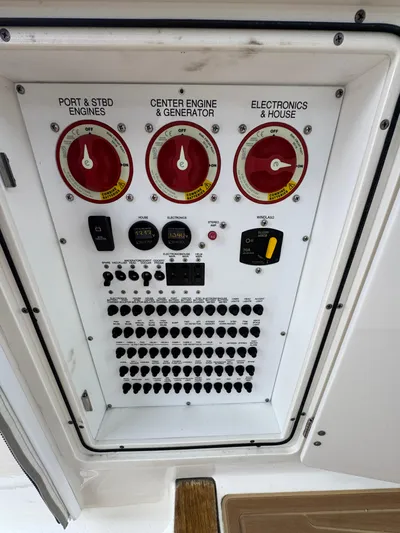  Yacht Photos Pics Control panel of a 2019 Pursuit DC 365 Dual Console boat with switches and dials.
