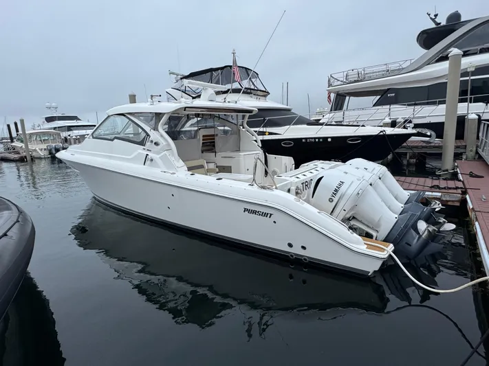  Yacht Photos Pics 2019 Pursuit DC 365 Dual Console boat docked with Yamaha outboard engines.