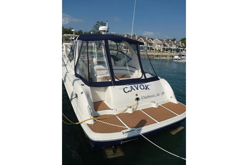 Cavok Yacht Photos Pics 2004 Sea Ray 420 Sundancer yacht docked in Charlevoix, MI, with clear canopy.
