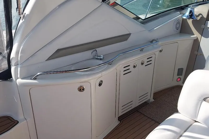 Cavok Yacht Photos Pics 2004 Sea Ray 420 Sundancer yacht interior with sink and storage cabinets.