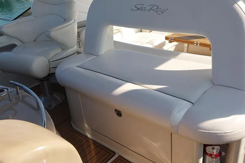 Cavok Yacht Photos Pics 2004 Sea Ray 420 Sundancer interior with white leather seating and wooden flooring.