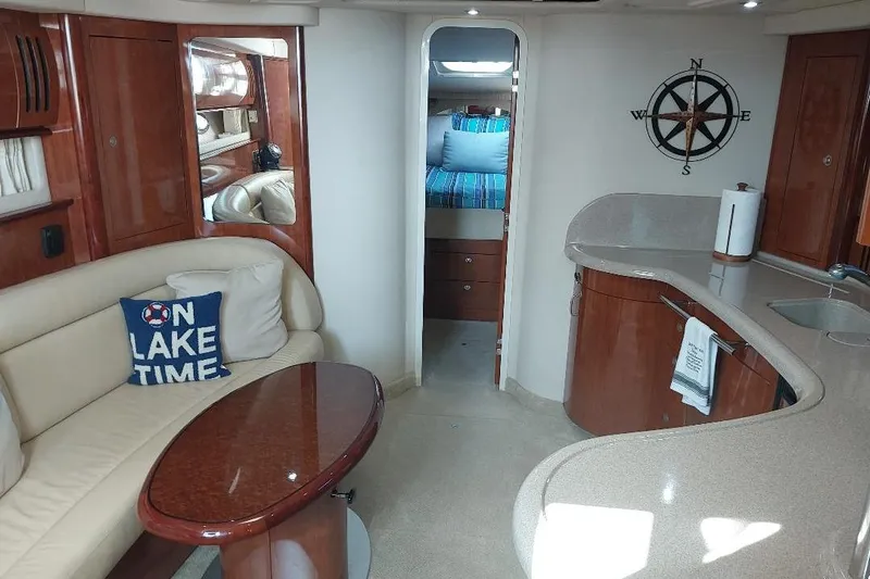 Cavok Yacht Photos Pics Luxurious 2004 Sea Ray 420 Sundancer interior with elegant seating and modern kitchen area.