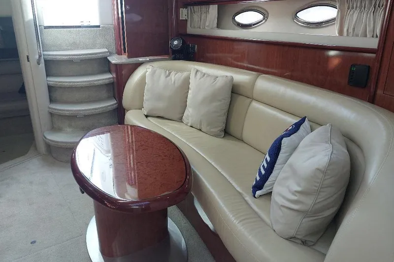Cavok Yacht Photos Pics Luxurious interior of 2004 Sea Ray 420 Sundancer with plush seating and elegant table.