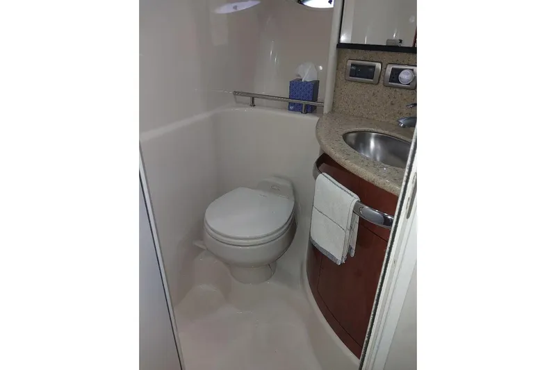 Cavok Yacht Photos Pics 2004 Sea Ray 420 Sundancer bathroom with toilet, sink, and countertop.