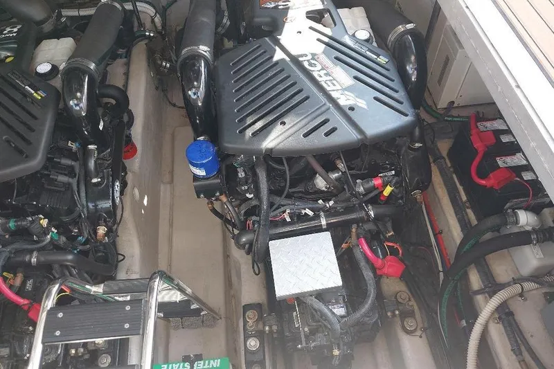 Cavok Yacht Photos Pics Engine compartment of a 2004 Sea Ray 420 Sundancer with visible MerCruiser engines.