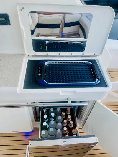 Anastasia Yacht Photos Pics Outdoor kitchen on 2010 Sea Ray 450 Sundancer with grill and beverage storage.