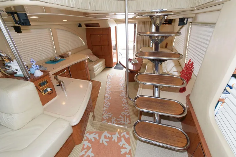  Yacht Photos Pics Luxurious interior of 2001 Sea Ray 540 Cockpit Motor Yacht with elegant furnishings.
