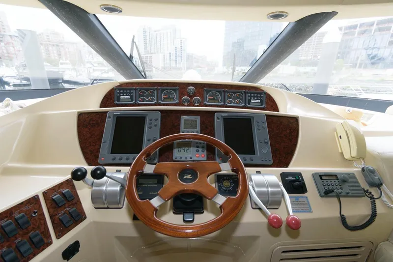  Yacht Photos Pics 2001 Sea Ray 540 Cockpit Motor Yacht helm with steering wheel and navigation controls.