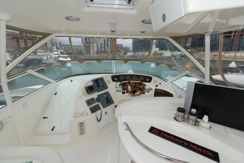  Yacht Photos Pics 2001 Sea Ray 540 Cockpit Motor Yacht helm with modern controls and city marina view.