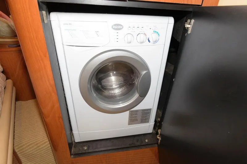  Yacht Photos Pics Washing machine inside 2001 Sea Ray 540 Cockpit Motor Yacht's wooden cabinet.