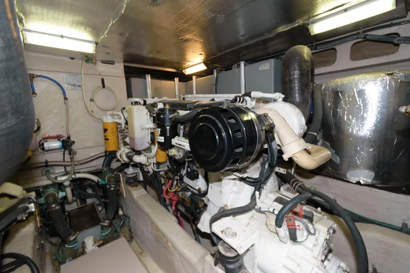  Yacht Photos Pics Engine room of 2001 Sea Ray 540 Cockpit Motor Yacht, showcasing mechanical components.