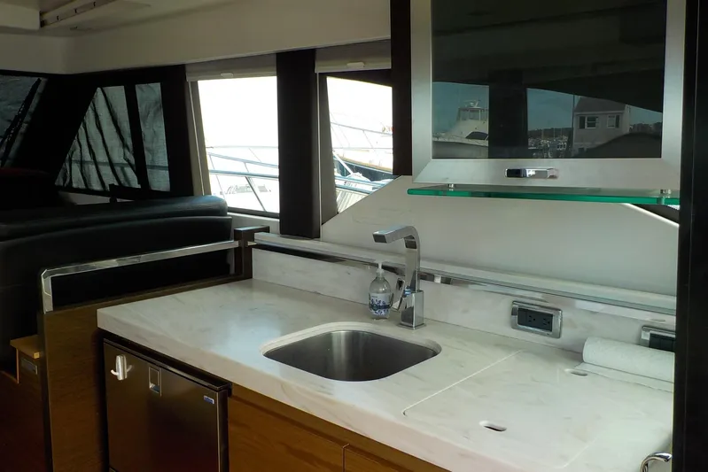 "double Dimond" Yacht Photos Pics Luxurious interior of 2018 Tiara Yachts 39 Coupe featuring modern kitchen amenities.