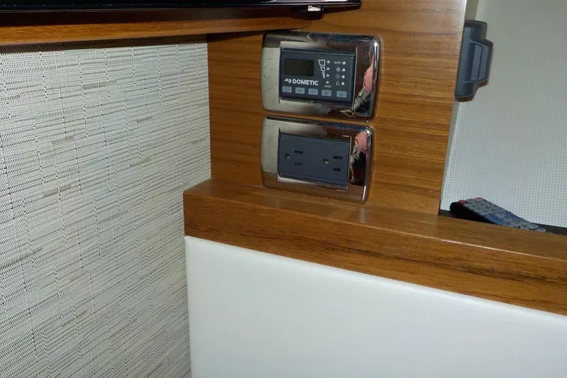 "double Dimond" Yacht Photos Pics Control panel and power outlet on 2018 Tiara Yachts 39 Coupe interior.