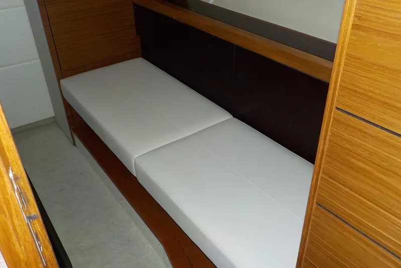 "double Dimond" Yacht Photos Pics Interior cabin of 2018 Tiara Yachts 39 Coupe with white seating and wooden accents.