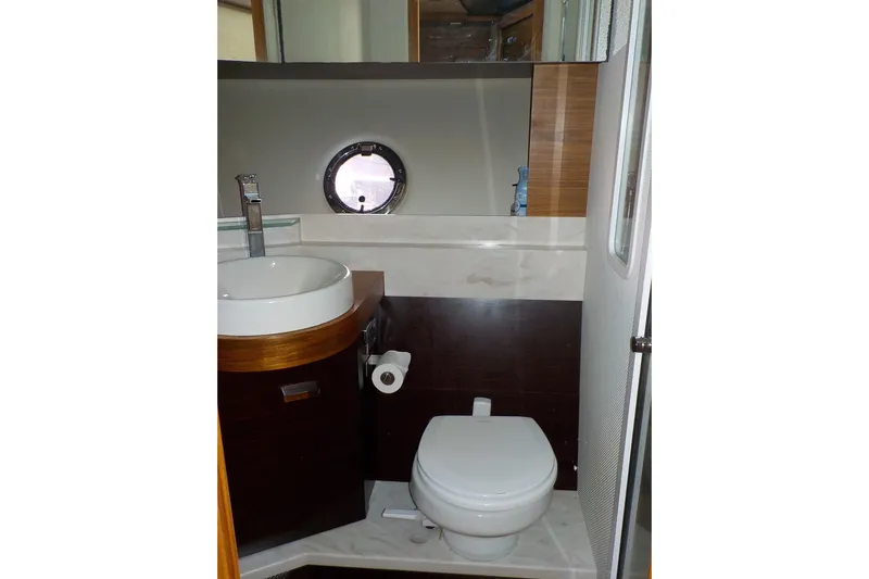 "double Dimond" Yacht Photos Pics Bathroom interior of 2018 Tiara Yachts 39 Coupe with modern sink and toilet.
