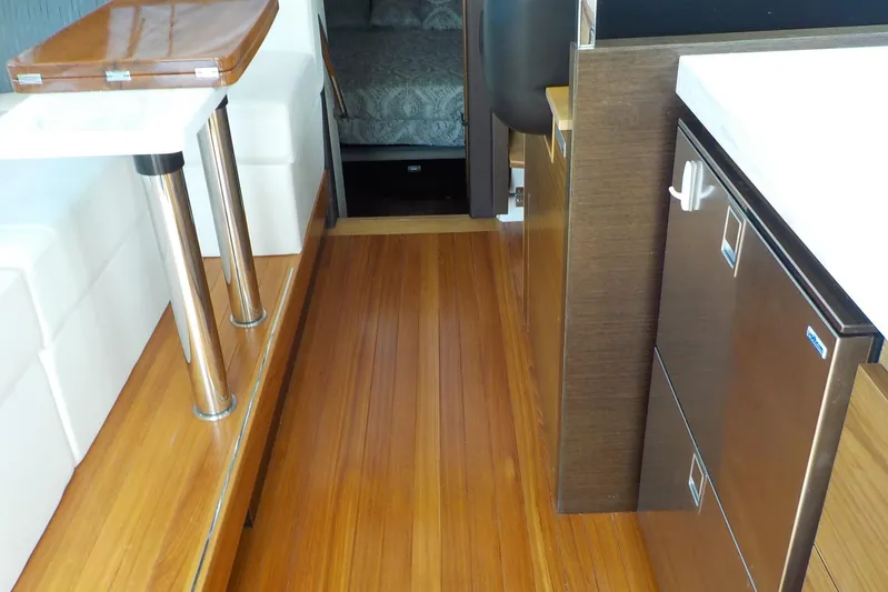 "double Dimond" Yacht Photos Pics Interior of 2018 Tiara Yachts 39 Coupe with wooden flooring and modern furnishings.