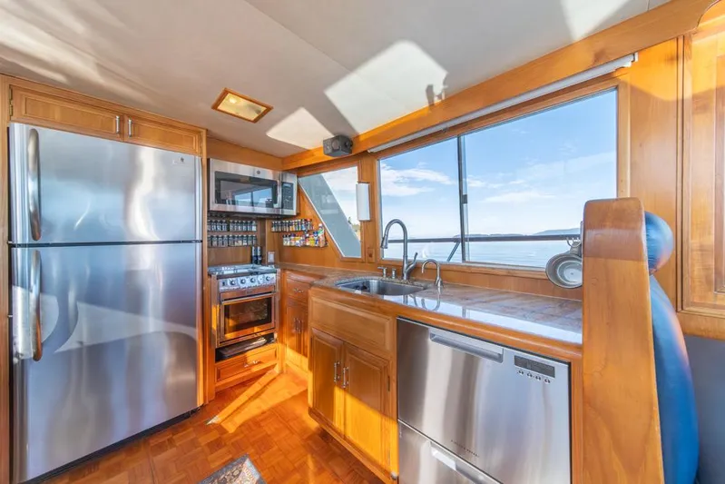 Take Chances Yacht Photos Pics Ocean Alexander 1986 Cockpit M/Y kitchen with stainless appliances and ocean view.