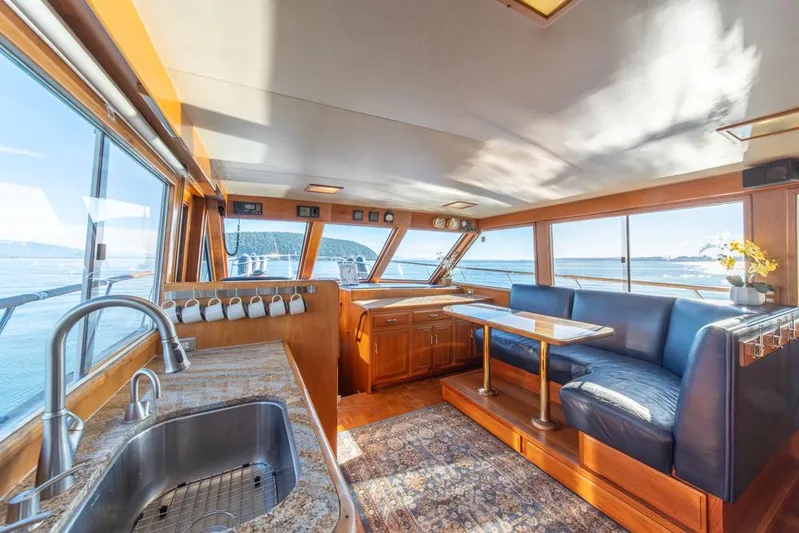 Take Chances Yacht Photos Pics Luxurious interior of 1986 Ocean Alexander Cockpit M/Y yacht with panoramic windows and elegant seating.