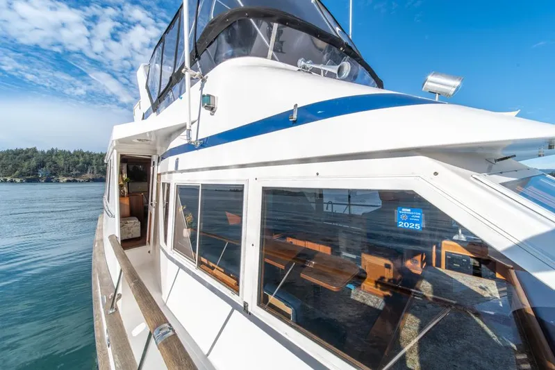 Take Chances Yacht Photos Pics 1986 Ocean Alexander Cockpit M/Y yacht on serene water under blue sky.