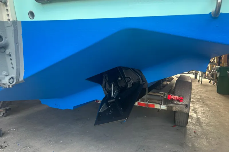  Yacht Photos Pics 2009 Venture 34 Tournament boat on trailer, blue hull, visible propeller area.