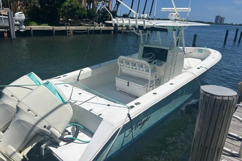  Yacht Photos Pics 2009 Venture 34 Tournament boat docked, featuring dual outboard engines and spacious deck.