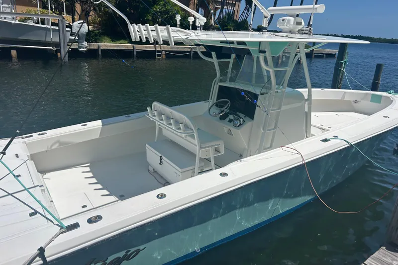  Yacht Photos Pics 2009 Venture 34 Tournament boat docked, featuring spacious deck and modern helm.