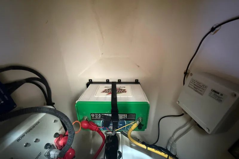  Yacht Photos Pics Battery compartment of 2022 Pursuit OS 355 Offshore boat with wiring and components.