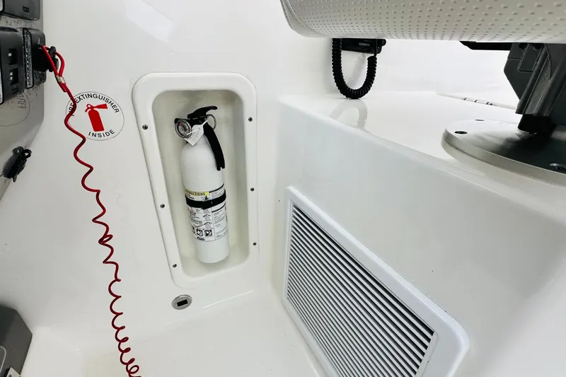  Yacht Photos Pics Fire extinguisher compartment on 2022 Pursuit OS 355 Offshore boat interior.