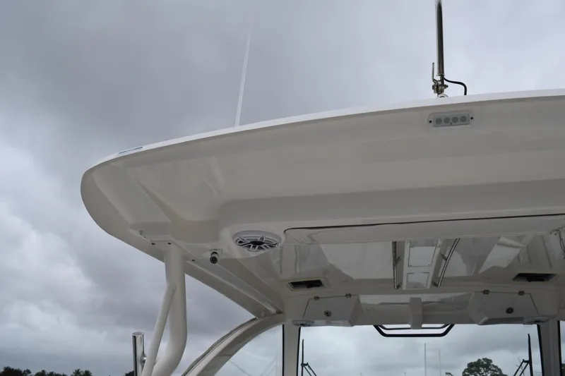  Yacht Photos Pics 2022 Pursuit OS 355 Offshore boat top view under cloudy sky.