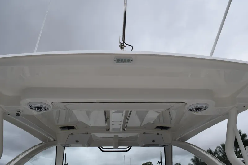  Yacht Photos Pics 2022 Pursuit OS 355 Offshore boat roof with speakers and lighting fixtures.