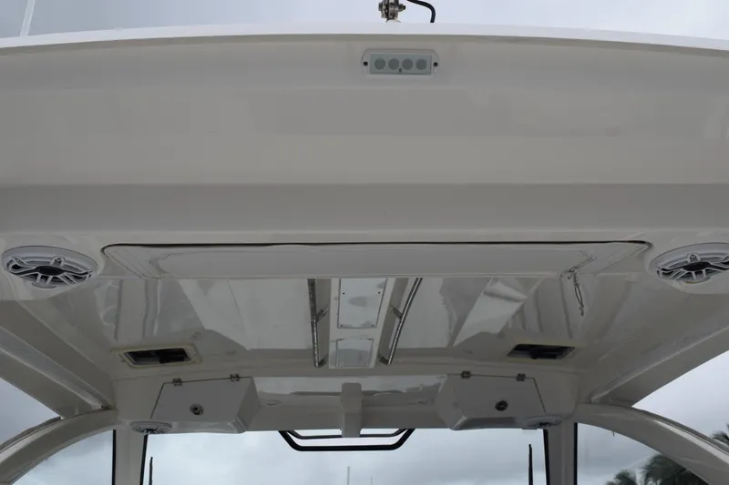  Yacht Photos Pics 2022 Pursuit OS 355 Offshore boat ceiling with speakers and lighting fixtures.