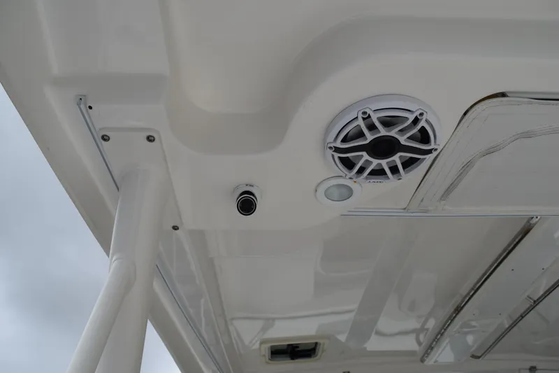  Yacht Photos Pics 2022 Pursuit OS 355 Offshore boat ceiling with speaker and light fixture.