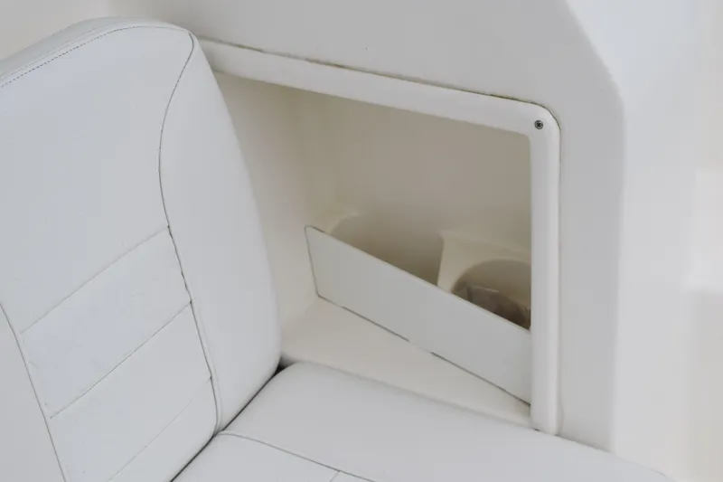  Yacht Photos Pics 2022 Pursuit OS 355 Offshore boat interior with white seating and storage compartment.