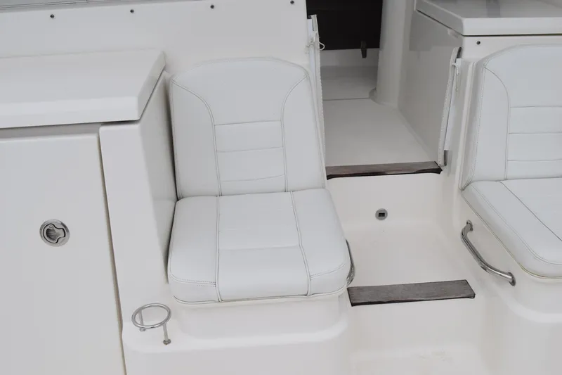  Yacht Photos Pics 2022 Pursuit OS 355 Offshore boat interior seating with white upholstery.