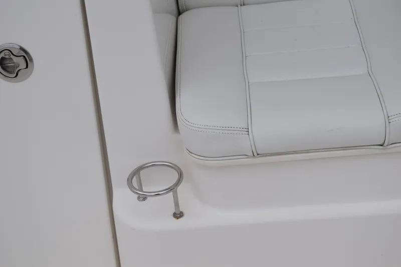  Yacht Photos Pics 2022 Pursuit OS 355 Offshore boat seat with cup holder detail.