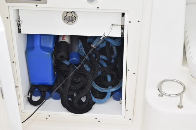  Yacht Photos Pics Storage compartment on 2022 Pursuit OS 355 Offshore boat with ropes and equipment.