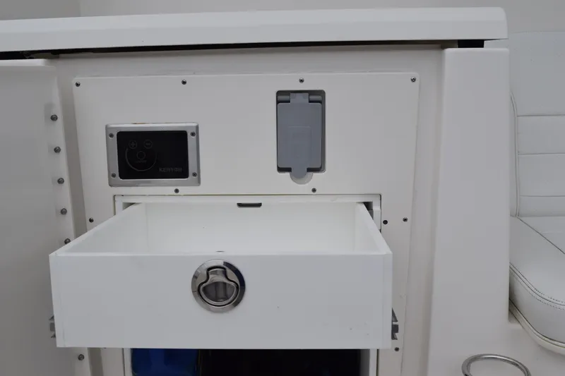  Yacht Photos Pics 2022 Pursuit OS 355 Offshore boat interior drawer with control panel.