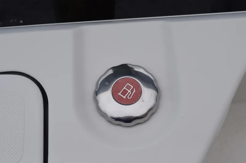  Yacht Photos Pics Fuel cap of 2022 Pursuit OS 355 Offshore boat with red emblem.