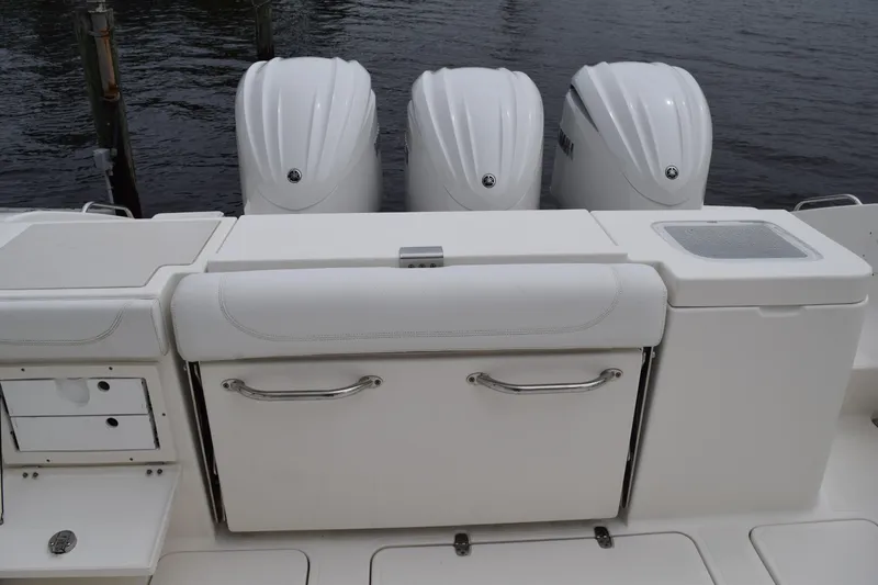  Yacht Photos Pics 2022 Pursuit OS 355 Offshore boat with triple outboard engines and sleek white deck design.