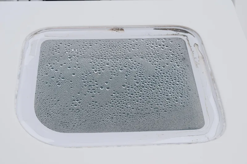  Yacht Photos Pics Close-up of a 2022 Pursuit OS 355 Offshore window with condensation droplets.