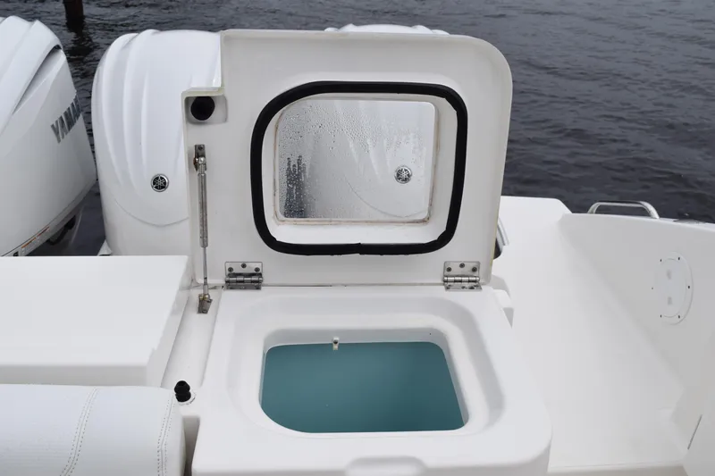  Yacht Photos Pics 2022 Pursuit OS 355 Offshore boat with open storage compartment and Yamaha engines.