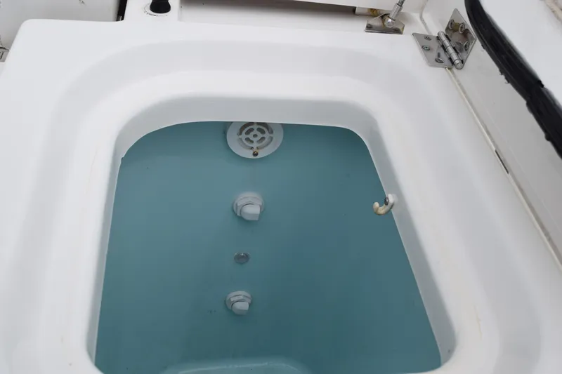  Yacht Photos Pics Livewell on 2022 Pursuit OS 355 Offshore boat, filled with water.