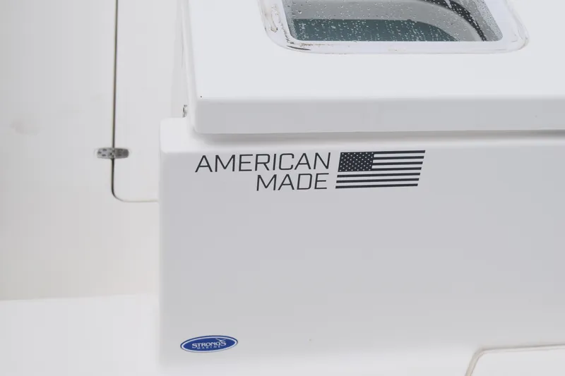  Yacht Photos Pics American-made Pursuit OS 355 Offshore boat, 2022 model, with flag decal.