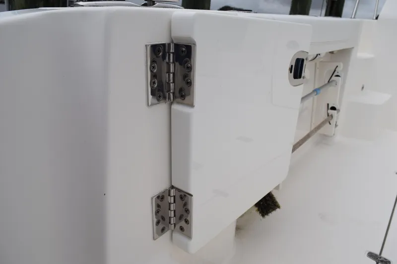  Yacht Photos Pics 2022 Pursuit OS 355 Offshore boat hinge detail, showcasing stainless steel hardware.