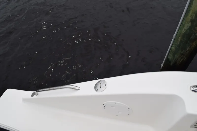  Yacht Photos Pics 2022 Pursuit OS 355 Offshore boat deck near water and dock.