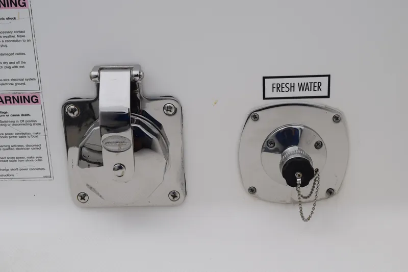  Yacht Photos Pics 2022 Pursuit OS 355 Offshore boat, fresh water inlet and electrical outlet.