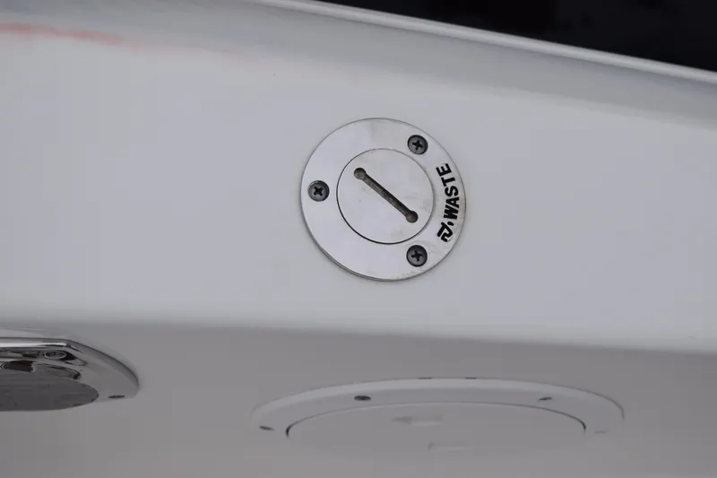  Yacht Photos Pics Waste outlet on 2022 Pursuit OS 355 Offshore boat, close-up view.