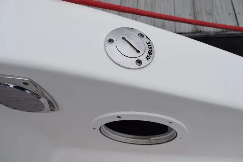  Yacht Photos Pics 2022 Pursuit OS 355 Offshore boat waste disposal port detail.