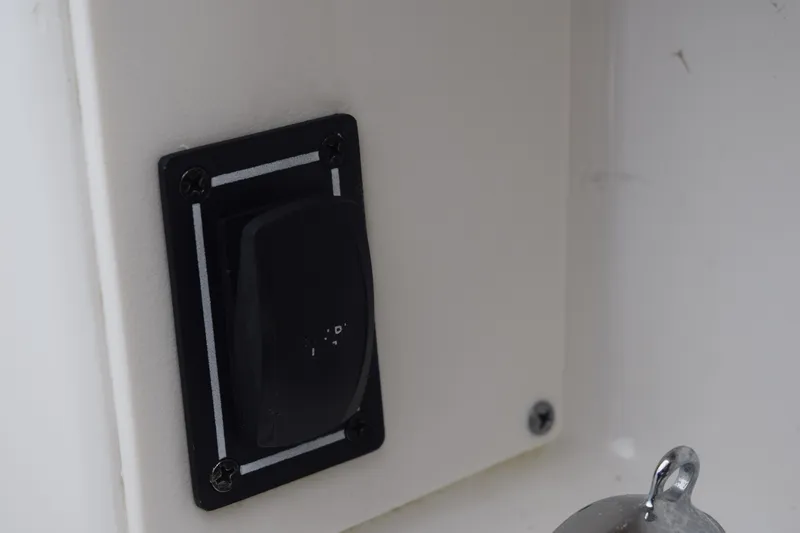  Yacht Photos Pics Switch panel on 2022 Pursuit OS 355 Offshore boat interior.